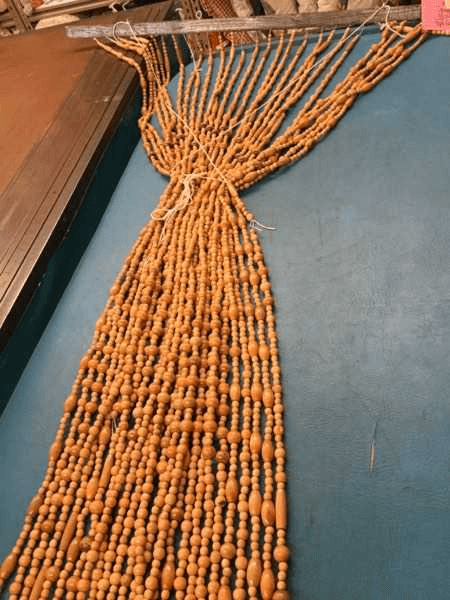 Wood Beads, Maple Color Approx 36" X 72", 2 Strands Missing, Light Damage, Drapery, Beaded Curtains, Beaded Curtain, Normal Wear And Tear, UNIVERSAL, 22522602, from Universal Studios Prop House
