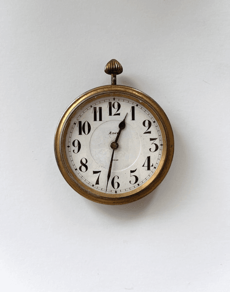 Small clock, gold outer casing, white back., 34190, from Lost + Found Props